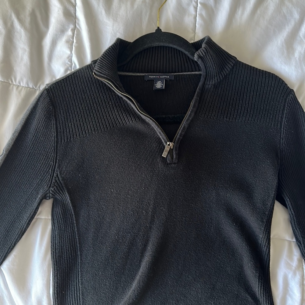 It is brand new small,neck zip up, sweater by Tommy Hilfiger.The color is black.